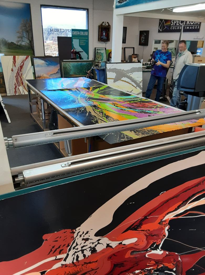 Artworks being prepared on a large-format table in the studio
